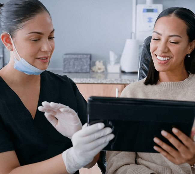 Dentist showing patient the treatment plan.